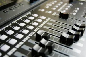 pexels-pixabay-159206 Close-up view of a professional audio mixing console with sliders and illuminated buttons, serving as a conceptual metaphor for adjusting internal financial controls and balancing multi-entity systems.